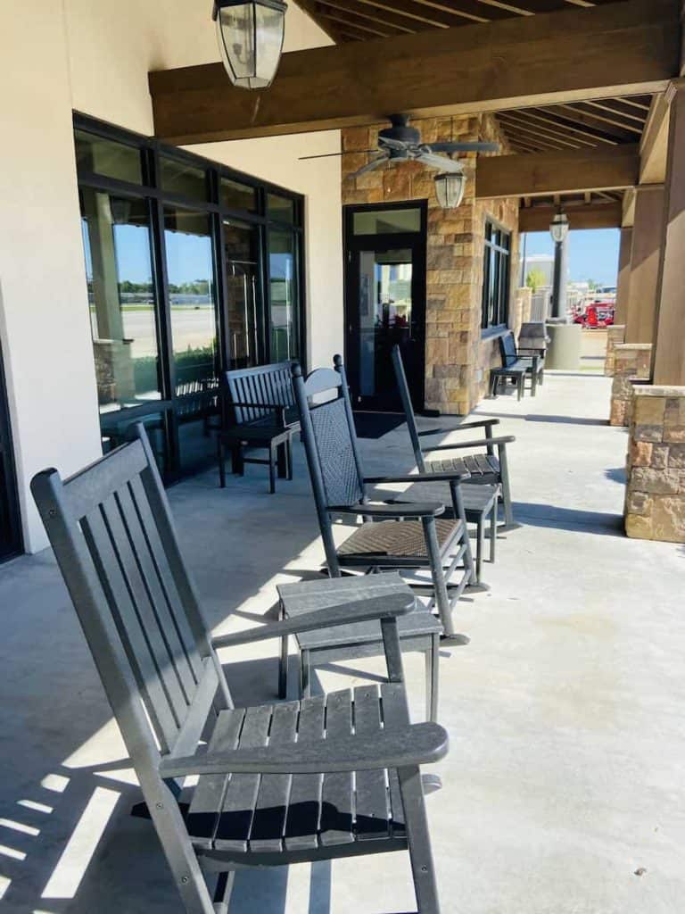 rocking chairs lined up on the porch at St Simons Island Airport